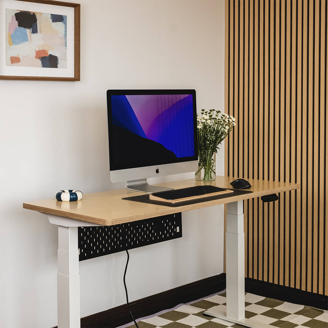 Modern home office setup with a computer desk, monitor, keyboard, and mouse.
