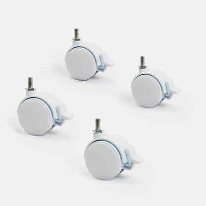 Four white caster wheels with metal axles on a light gray background