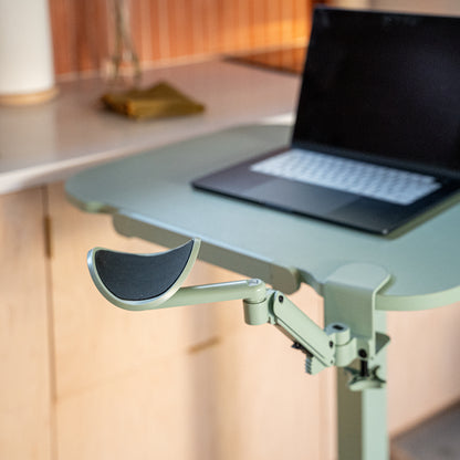 Portable laptop desk with a laptop on a blurred indoor background