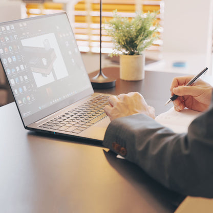 man working on a standing desk