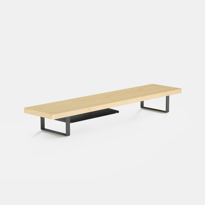 light woodgrain bench with black metal legs monitor shelf on a white background