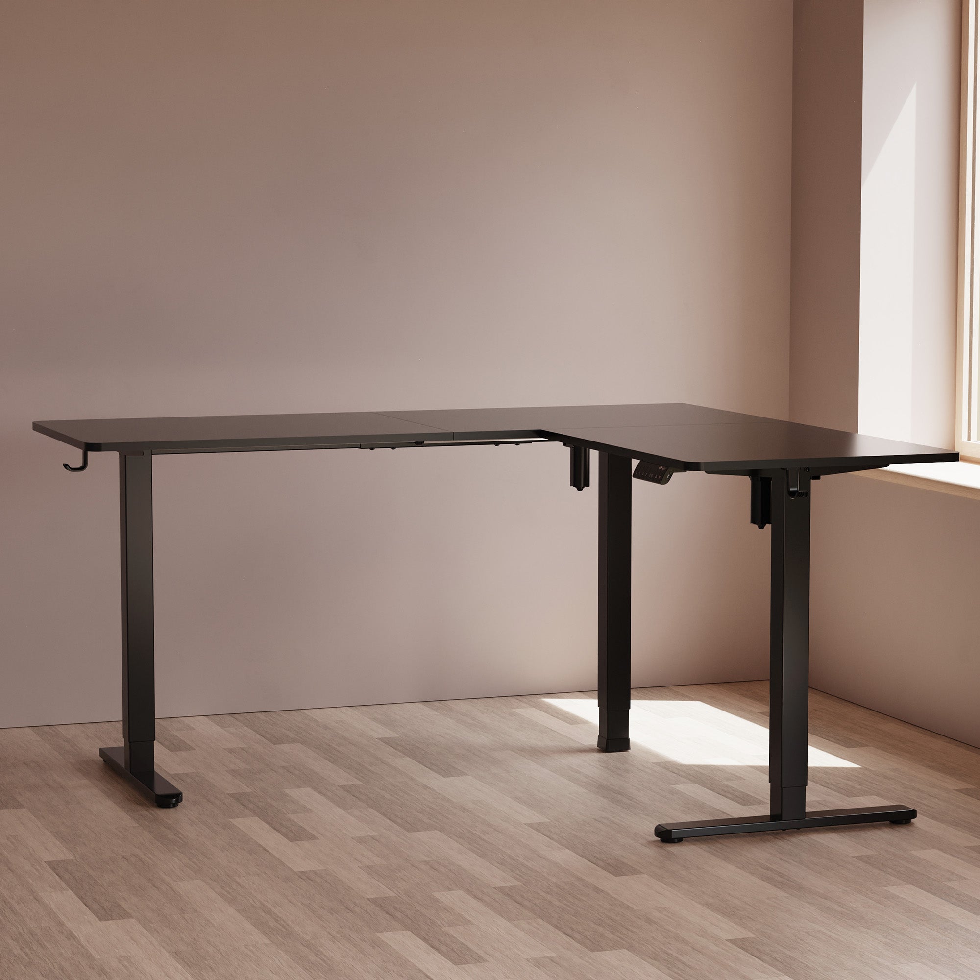 LiftSync Pro L standing desk in black with L-shape design