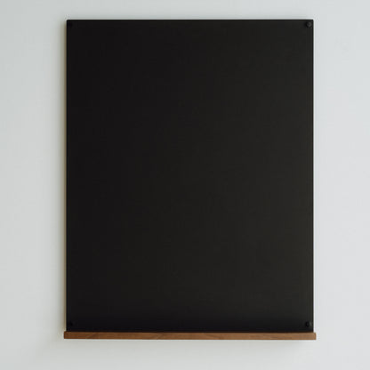 Black magnetic board on a white background