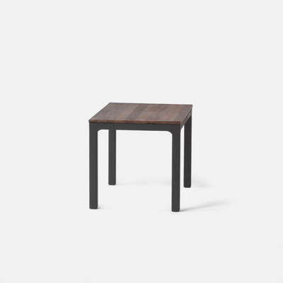 solid wood walnut standing desk with dark legs on a white background