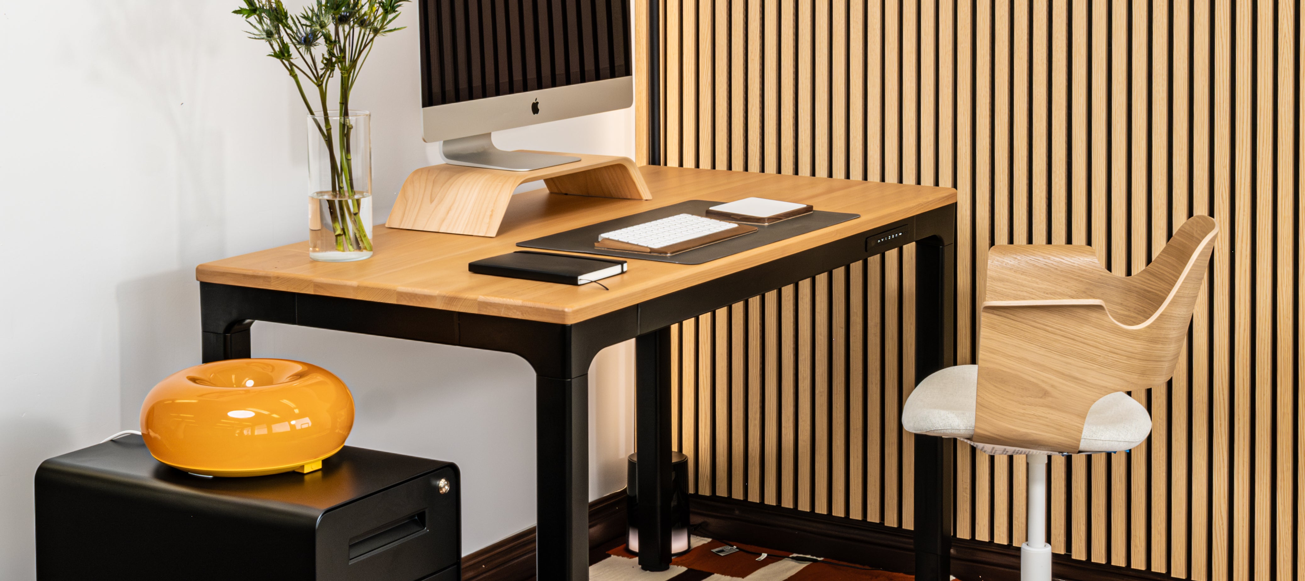 Modern office setup with a desk, chair, and computer monitor.